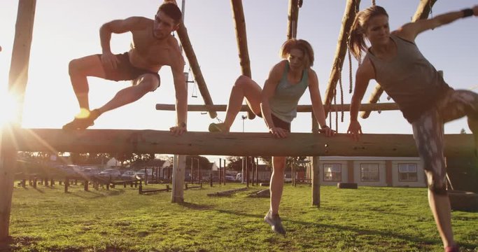Young adults training at an outdoor gym bootcamp