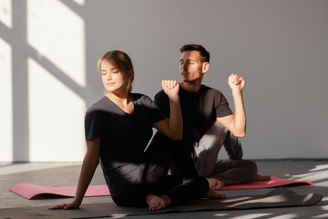 Couple is doing yoga together. Healthy lifestyle concept.