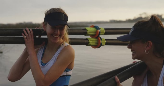 Female rowing team training on a river