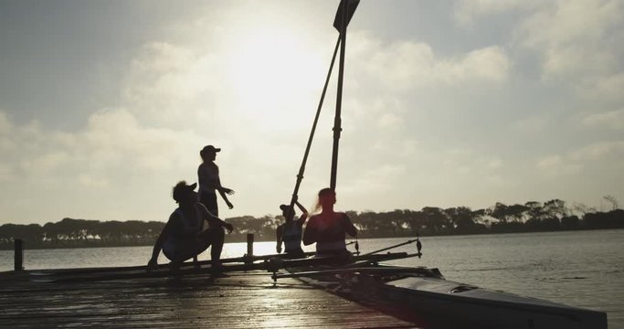 Female rowing team training on a river