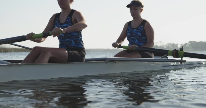 Female rowers training on a river