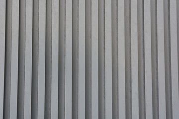 Gray metal striped wall. Texture.