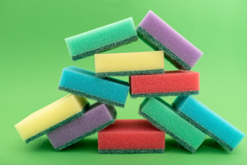 sponges for dishwashing isolated on green background