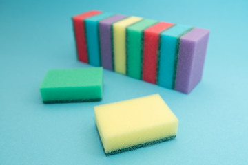 sponges for dishwashing isolated on blue background