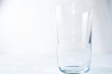 Empty glass isolated on a blue background
