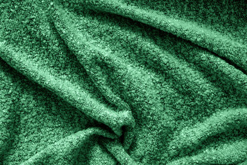 Fototapeta na wymiar Background with fabric in fashionable color. A mysterious color forest green Eden, the color of 2020. Color palette. Love fashion.