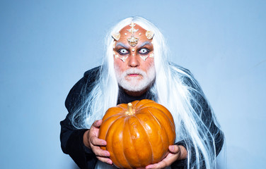 Halloween man. Bloody skin for Halloween. Halloween holiday celebration - Man demon on black...
