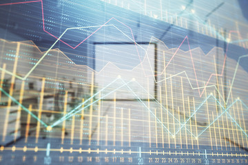 Stock market chart with trading desk bank office interior on background. Double exposure. Concept of financial analysis