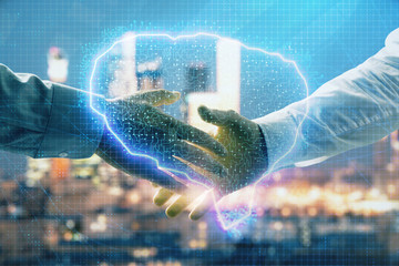 Double exposure of human brain drawing on city view background with handshake. Concept of brainstorm