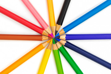 Naklejka premium colorful pencils point together ons on white background