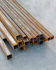 Pile of structural steel square tubes on the ground