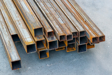 Pile of structural steel square tubes on the ground
