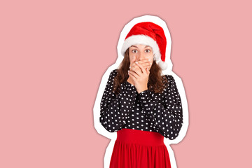 Pretty girl covering her mouth. emotional girl in santa claus christmas hat Magazine collage style with trendy color background. holiday concept