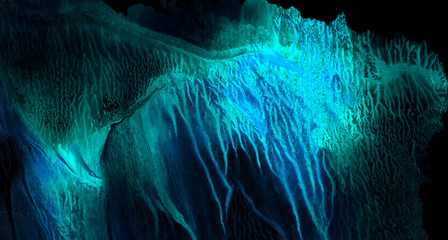 Bright light blue neon watercolor on deep black paper background. Aquarelle painted ink canvas for modern creative design. Lightning night sky and thunder storm, smoke texture illustration.