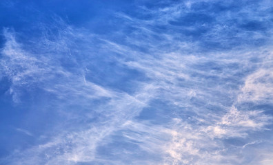 White clouds on a blue background.