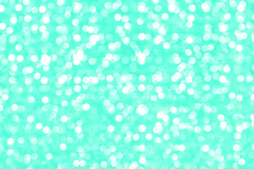 Modern beautiful holographic background of holiday lights bokeh in trendy mint color. Wallpaper design.