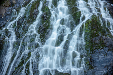 Naklejka na ściany i meble Water streams of Balea Cascada waterfall in Fagaras mountains, Romania