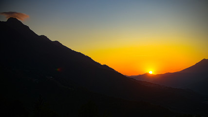 Sunset mountain valley hills landscape. Mountain valley sunset panorama.