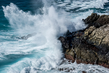 Waves crashing on rocks