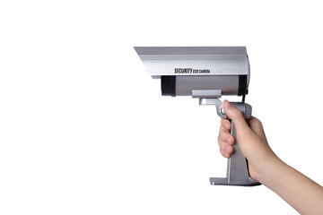 Close up security camera in the hands of a woman on white background. Free from copy space.