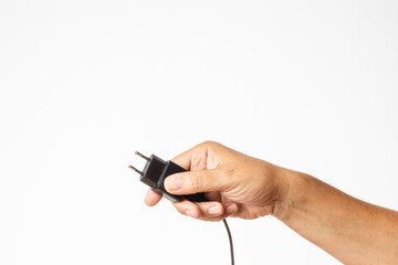 hand holding a plug charger isolated on white background