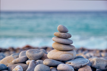 Fototapeta na wymiar Zen balanced stones stack on beach