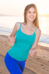Female in blue T-shirt is jogging