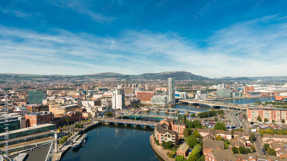 Wall mural aerial view on river and buildings in city center of belfast northern ireland. drone photo, high ang