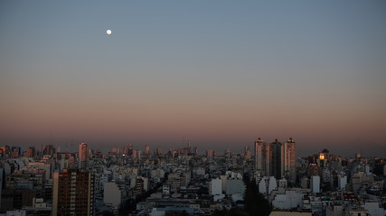 Fototapeta premium The moon and the city