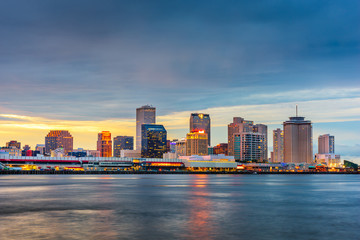 New Orleans, Louisiana, USA night skyline on the Mississippi River.