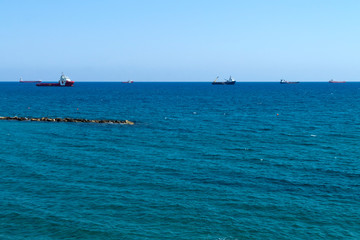 Panorama of blue sea with ships on horizon