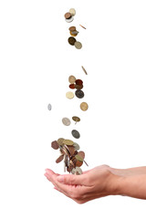 Coins falling down in the palm of a hand