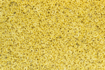 Italian pasta background. A large amount of fine pasta
