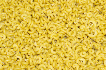 Italian pasta background. A large amount of fine pasta