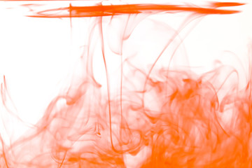 flowing red ink in water isolated on white background