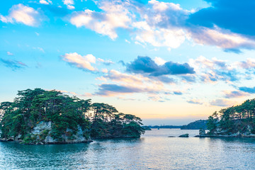 Matsushima Bay in dusk, beautiful islands covered with pine trees and rocks. One of the Three Views of Japan, and is also the site of the Zuigan-ji, Entsu-in and Kanrantei. in Miyagi Prefecture, Japan
