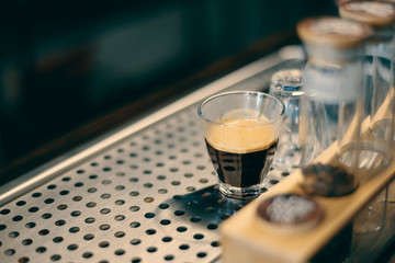 Espresso coffee shot with bubble foam on surface
