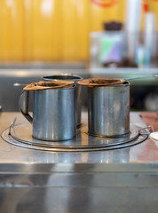 Stainless steel coffee cans,Antique coffee cans In the coffee shop beside the street in Thailand