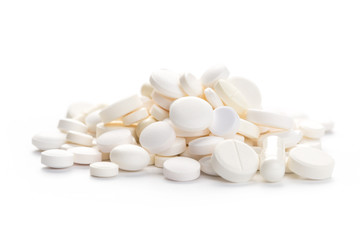 Fototapeta na wymiar Medical,pharmacy theme background concept. White pills on white background.