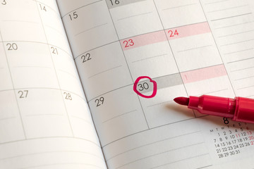 Mark on date circled on month calendar, Red circle on 30 with Red Magic Pen. 