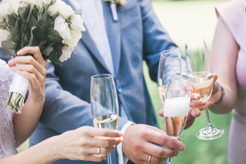 champagne in glasses in hands