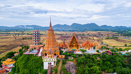 Fototapeta premium Aerial view of Tiger Cave Temple (Wat Tham Sua) in Kanchanaburi, Thailand. Tiger cave Temple of mountain in Kanchanaburi, Thailand.