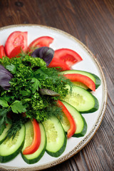 Sliced vegetables with herbs . catering menu