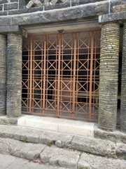Gated stone building