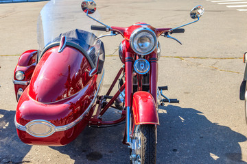 Retro tricar. Three-wheeled motorcycle on city street