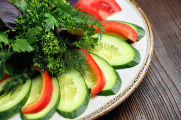 Sliced vegetables with herbs . catering menu