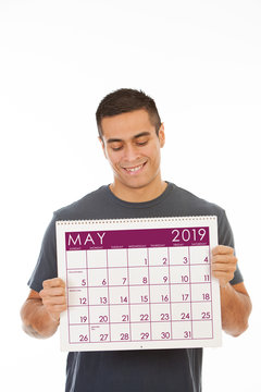 Smiling Man Holds May 2019 Calendar