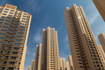 Fototapeta na wymiar The residential quarter bristles with tall buildings