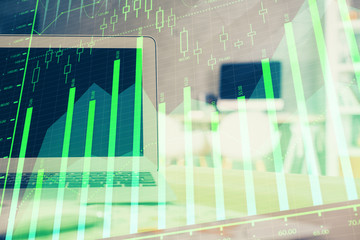 Forex Chart hologram on table with computer background. Multi exposure. Concept of financial markets.