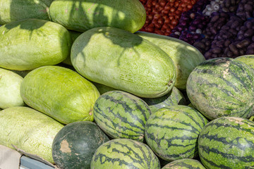 stack pile of watermelons on the farm market after harvest. Eco farm product.